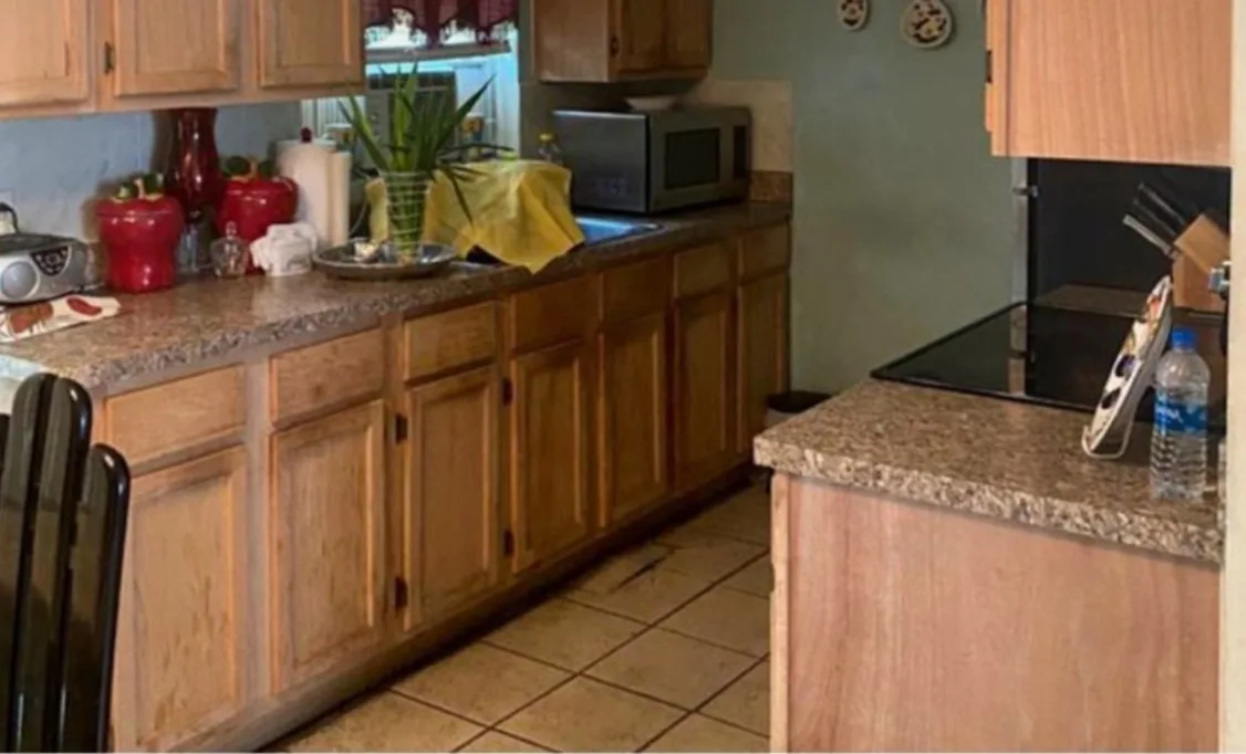 Before: Kitchen before the remodel: oak cabinets