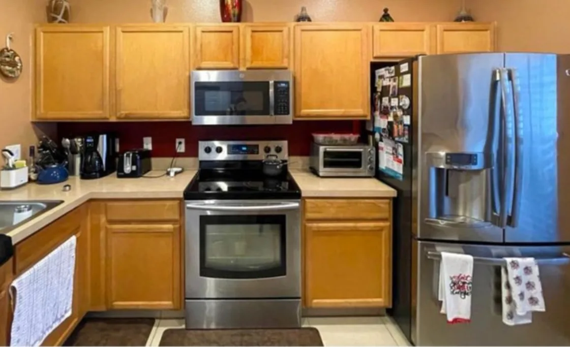 Before: Kitchen before the remodel: oak cabinets