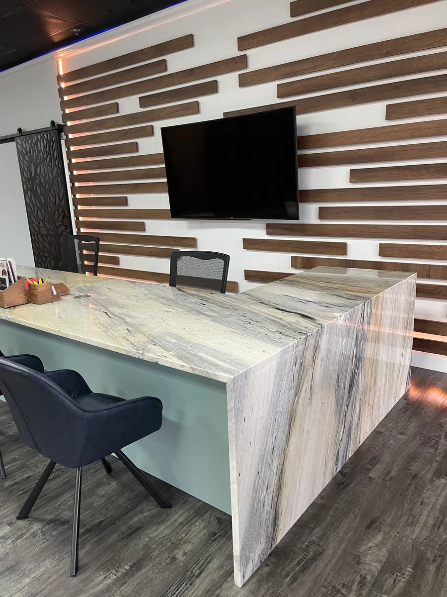 Design desk with a waterfall stone top in the showroom